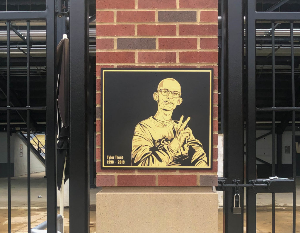 Tyler Trent's image on a plaque.